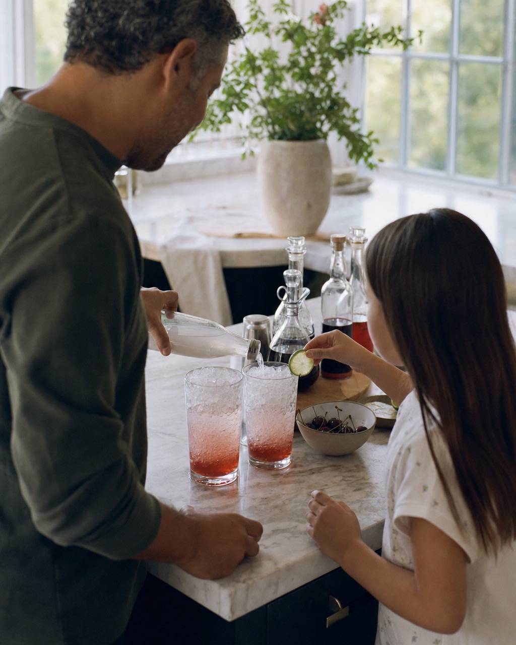 A family building sodas together at a kitchen island